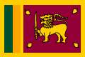 DRAPEAU DU SRI LANKA - Fond jaune, � gauche bandes verticales verte (musulmans) et orange (Tamouls). A droite, lion jaune portant une �p�e (autorit�) sur fond brun et 4 feuilles (symboles bouddhistes) (1978)